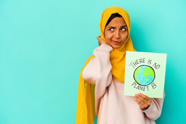 Premium Photo | Young Muslim Woman Holding A There Is Not Planet B ...