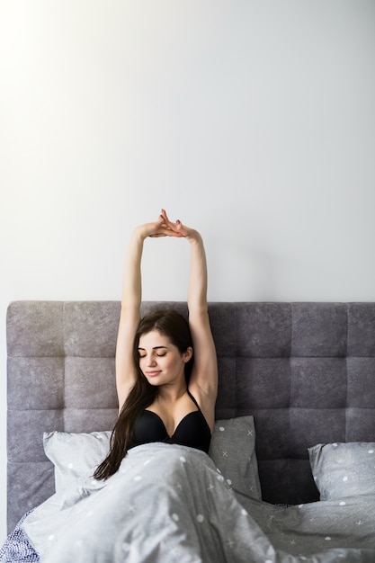 Free Photo Young Pretty Woman Stretching In The Bed Morning Concept