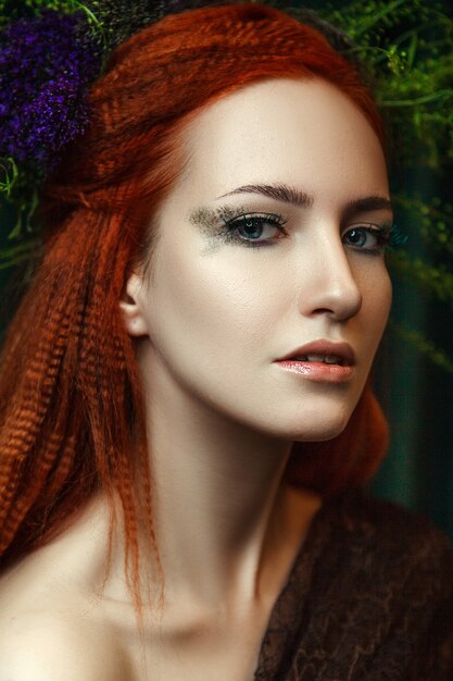Premium Photo | Young red head model is posing with a creative makeup