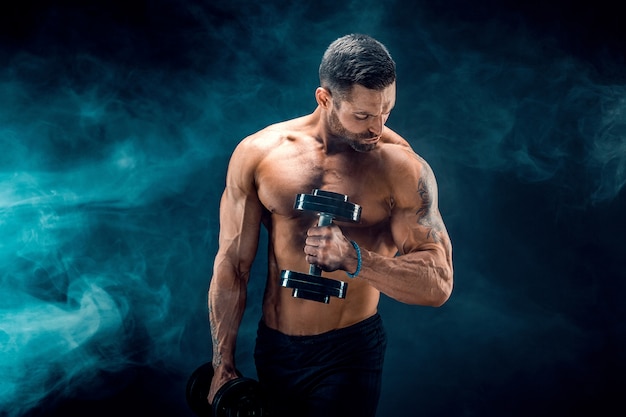 young-ripped-man-bodybuilder-with-perfect-abs-shoulders-biceps-triceps-chest-posing-with-dumbbell_136403-1032.jpg (626×417)