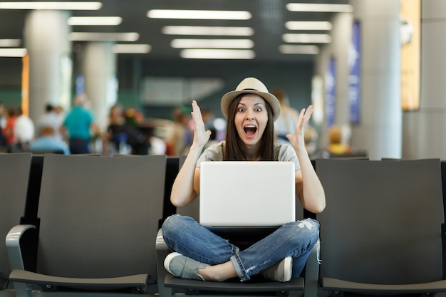 Premium Photo Young Shocked Traveler Tourist Woman With Laptop With 