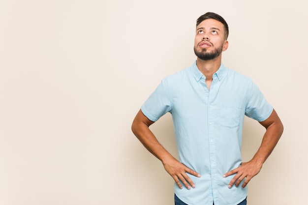 Young South Asian Man Tired Of A Repetitive Task Photo Premium