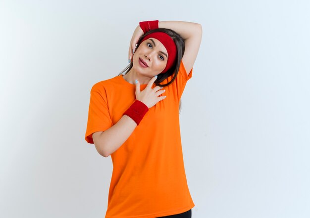 Free Photo Young Sporty Woman Wearing Headband And Wristbands Leaning Head To Side Looking 