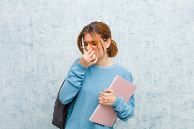 Premium Photo Young Student Woman Feeling Disgusted Holding No