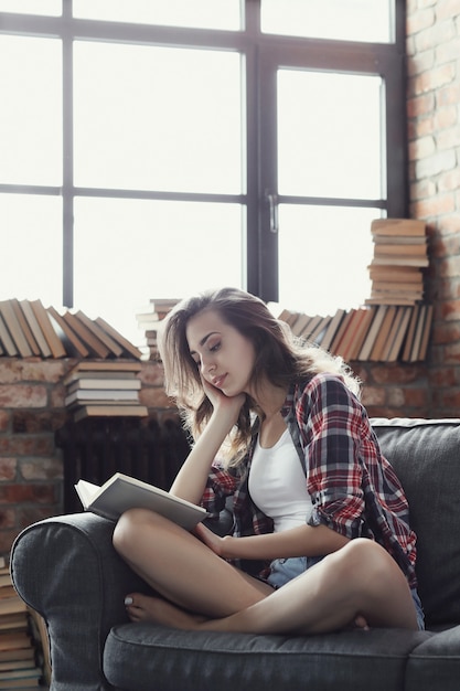 Free Photo Young Teenager Girl Reading A Book At Home