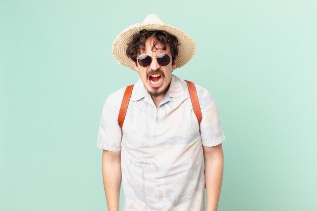 Premium Photo | Young traveller tourist shouting aggressively, looking ...