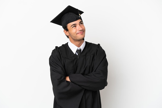 Premium Photo | Young university graduate over isolated white ...