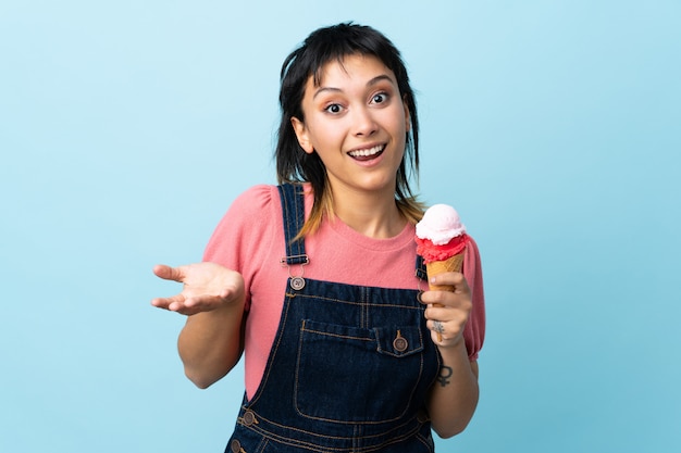 Premium Photo | Young uruguayan girl holding a cornet ice cream over ...