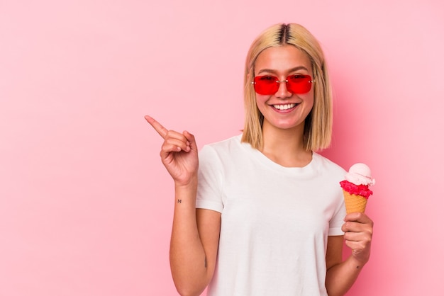 Premium Photo Young Venezuelan Woman Eating An Ice Cream Isolated On Pink Wall Smiling And 