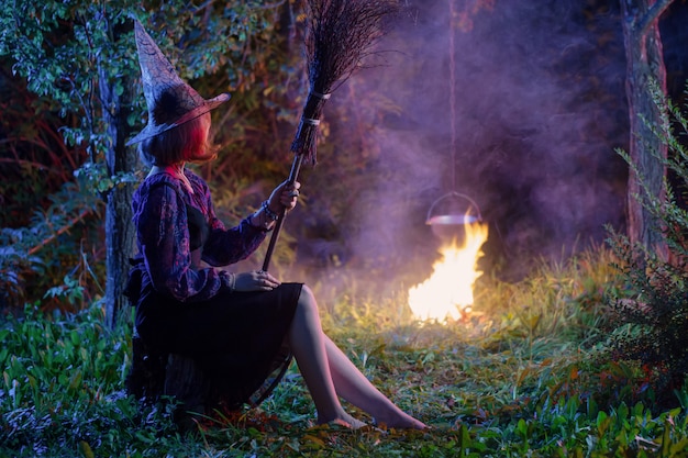 https://image.freepik.com/free-photo/young-witch-by-fire-night-forest_176873-6373.jpg