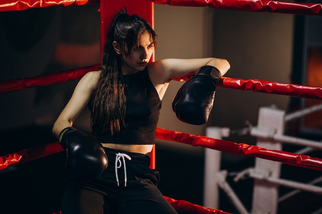 Free Photo | Young woman boxer training at the gym