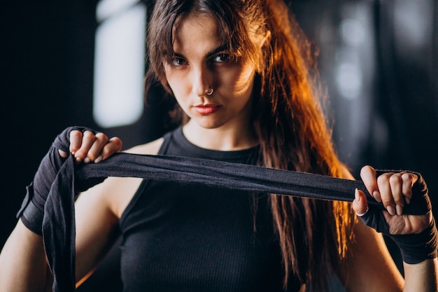 Young woman boxer training at the gym Free Photo