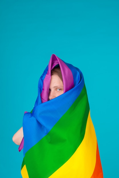 Premium Photo | Young woman covering with lgbt pride flag
