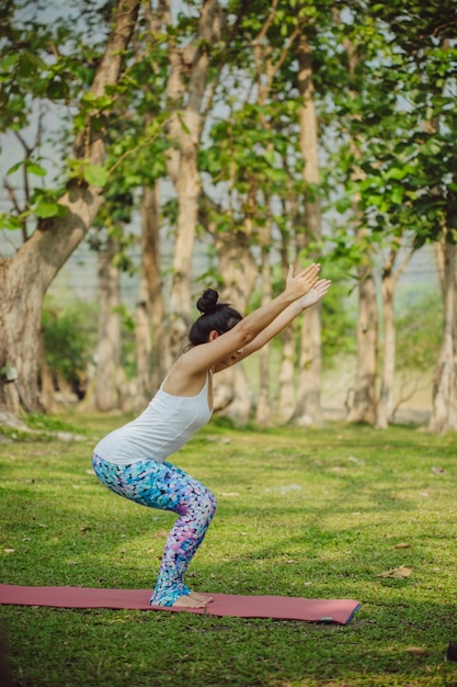 Free Photo | Young woman doing yoga in a sunny day