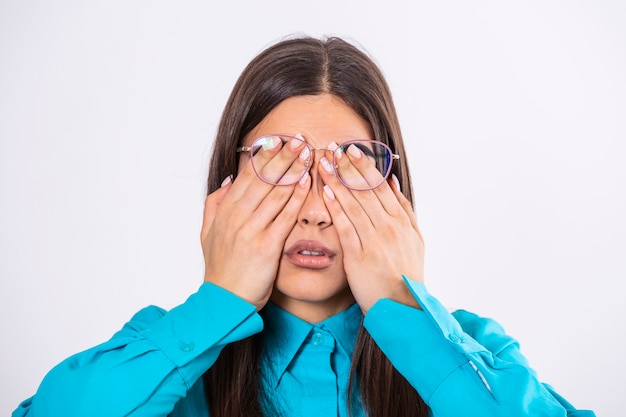 Premium Photo | Young woman in glasses rubs her eyes, suffering from ...