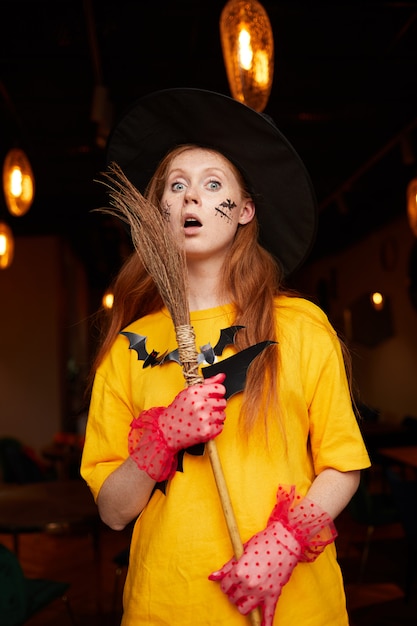 Premium Photo | Young woman at halloween party in nightclub