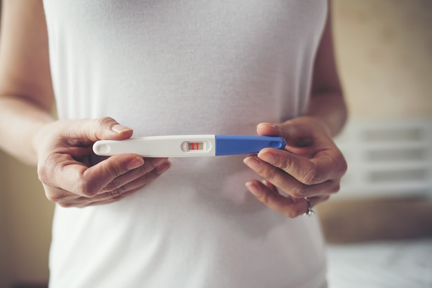 Free Photo | Young woman hand holding pregnancy test