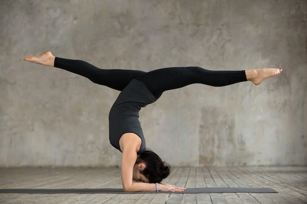 Free Photo | Young woman in handstand pose