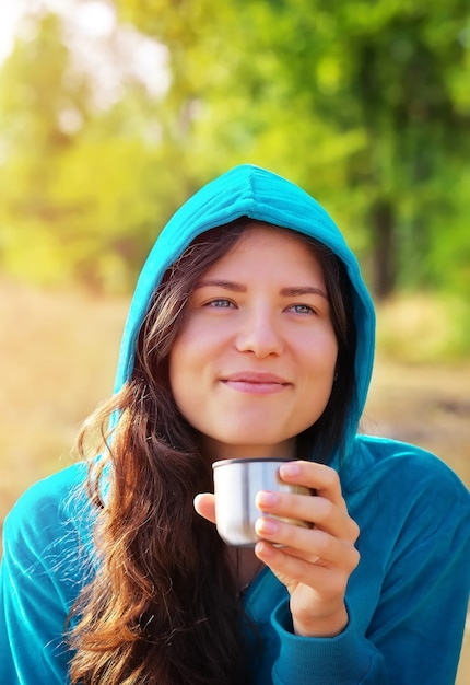 Premium Photo Young Woman Holding Cup Of Coffee Or Tea And Smiling