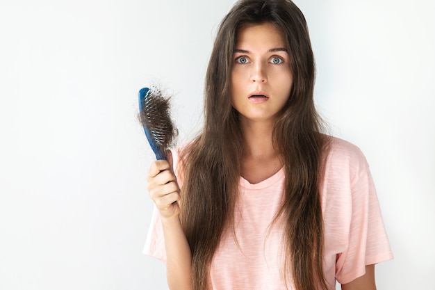 Premium Photo Young woman is upset because of hair loss