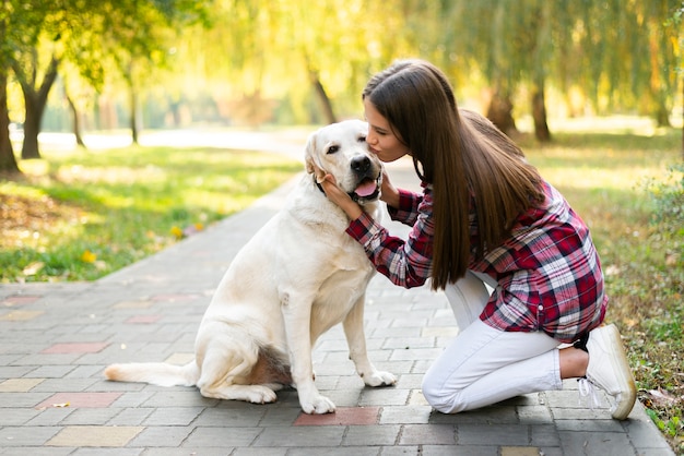 Free Photo | Young woman in love with her dog