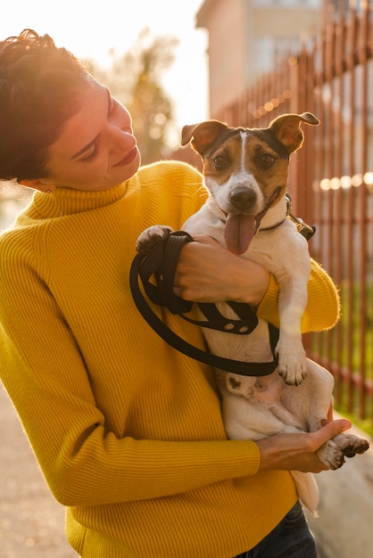 Young woman in love with her pet | Free Photo