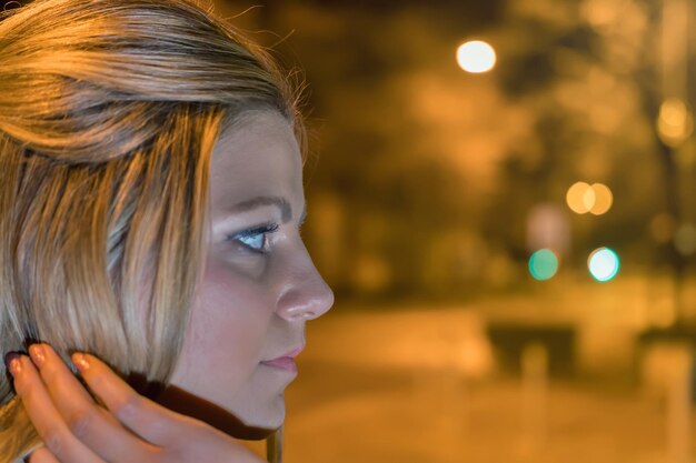 Premium Photo | Young woman on the night city street. night bokeh. girl ...