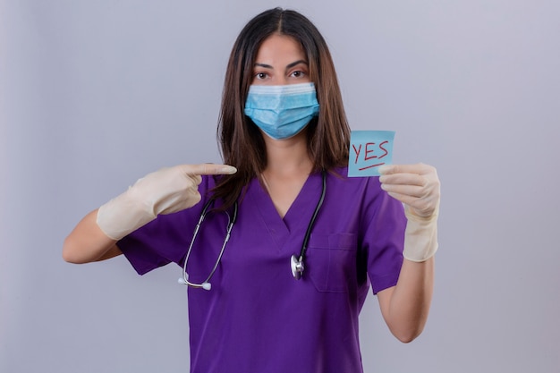 Free Photo Young Woman Nurse Wearing Medical Uniform Protective Mask