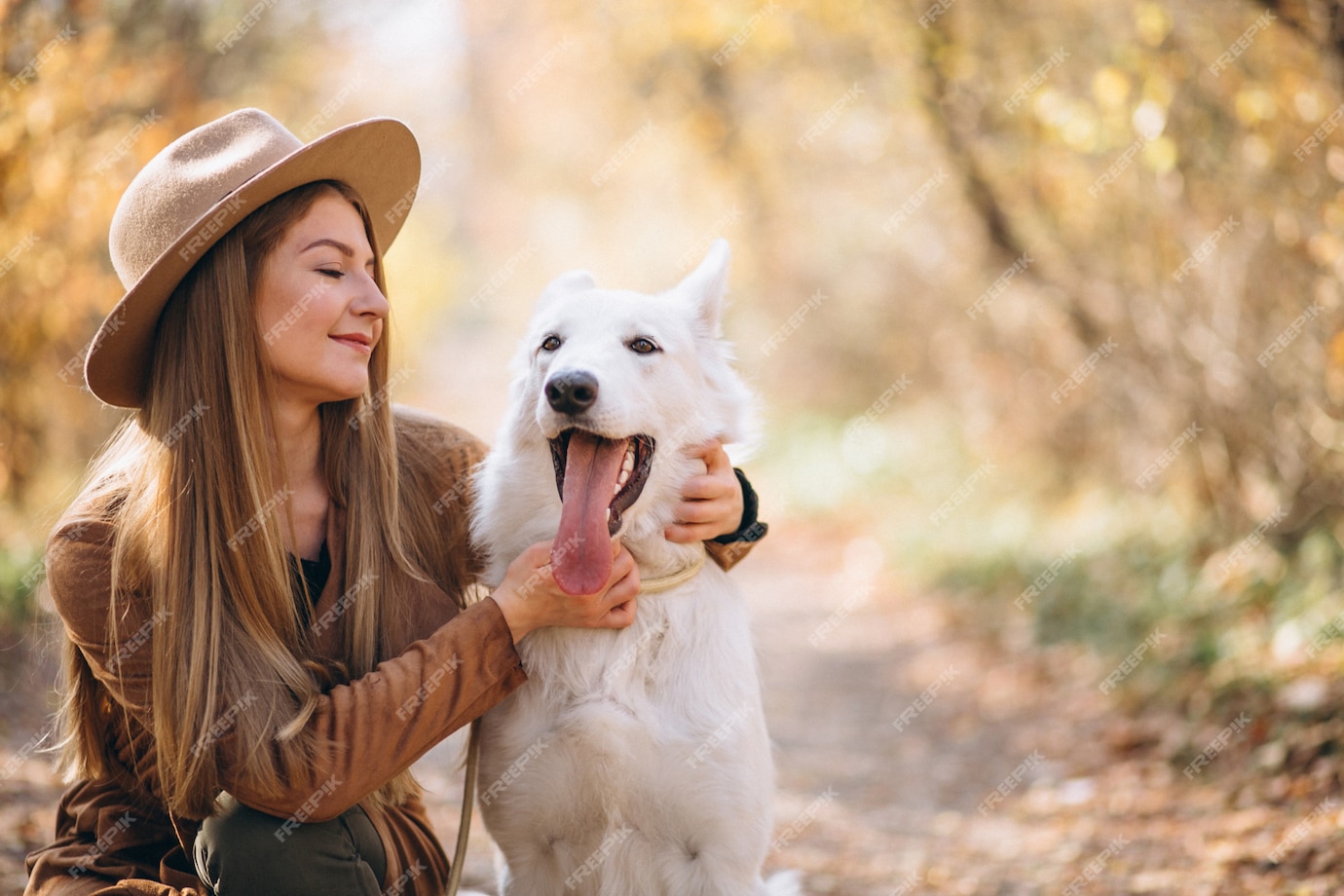 Free Photo | Young woman in park with her white dog