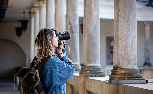 Premium Photo Young Woman Professional Photographer With Camera In Old Castle Traveler Concept