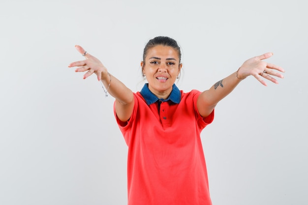 Free Photo Young Woman In Red Tshirt Stretching Hands As Inviting To