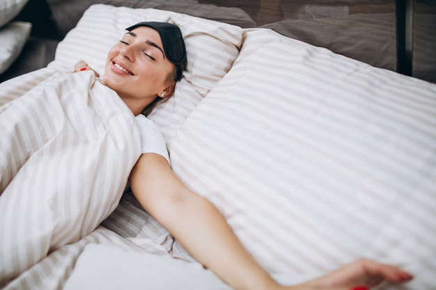 Free Photo | Young woman resting in bed in the morning