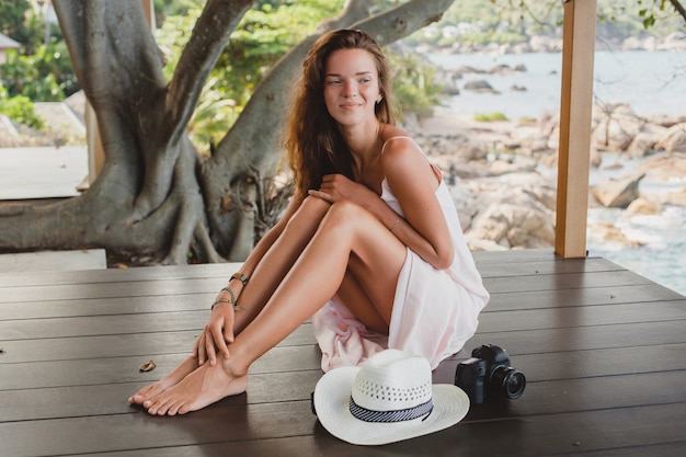 Free Photo Young Woman Sitting On Floor Barefoot In Pale Dress