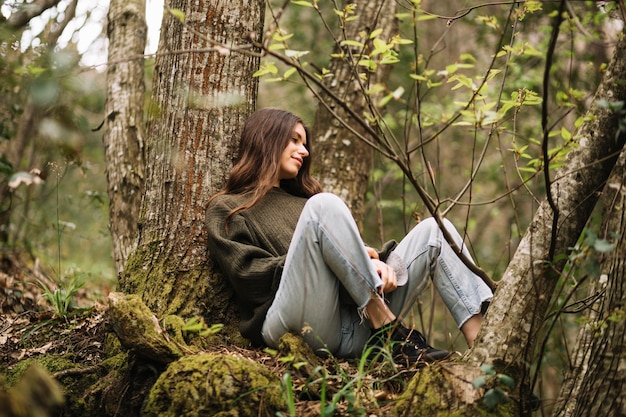 Free Photo Young Woman Sitting In Nature