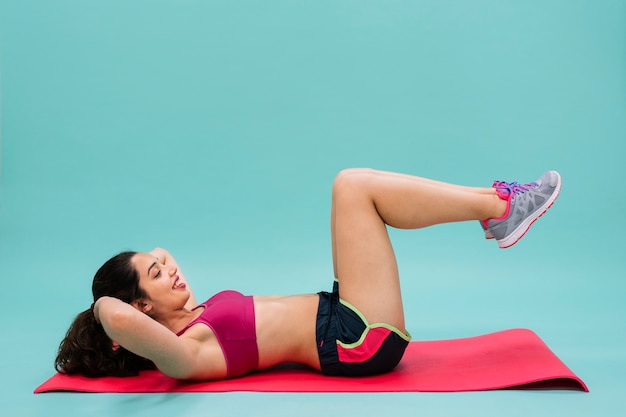 Young woman training abdominals