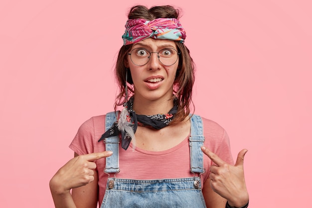 Free Photo | Young woman wearing colorful headband and denim overalls