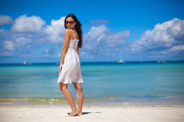 Premium Photo | Young woman in white dress enjoy the beach vacation