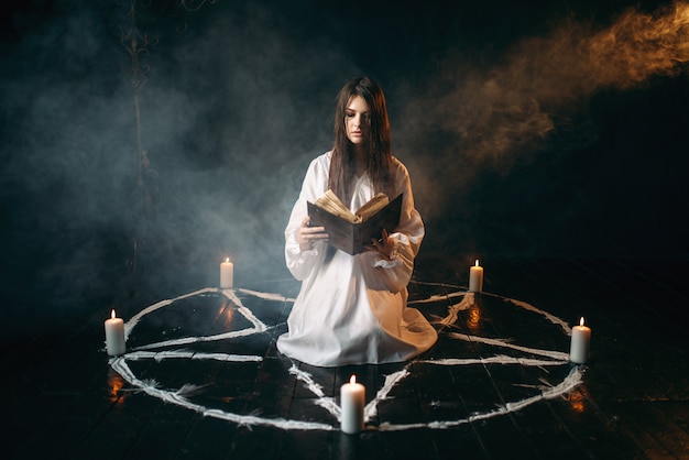 Premium Photo Young Woman In White Shirt Sitting In The Center Of Pentagram Circle With 4136