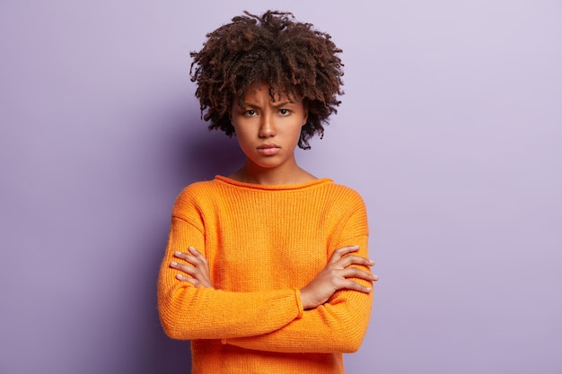 Free Photo | Young woman with afro haircut wearing orange sweater