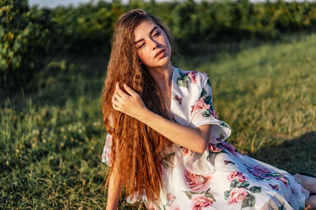 Premium Photo | Young woman with long curly hair, brunette, face in ...