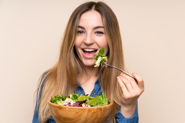 Premium Photo | Young woman with salad