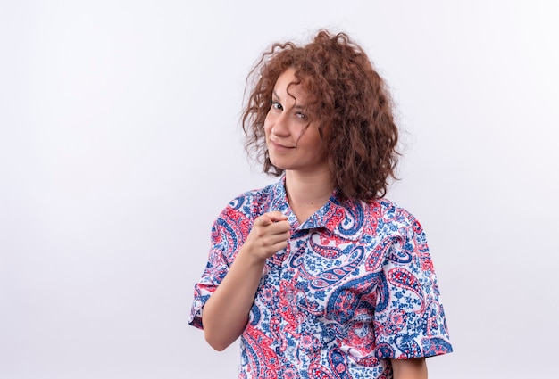 Free Photo Young Woman With Short Curly Hair In Colorful Shirt Looking Confident Smiling 3226