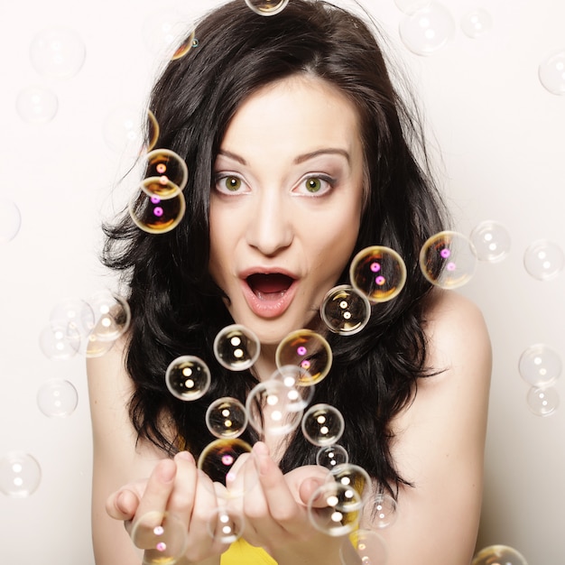 Premium Photo Young Woman With Soap Bubbles 4620