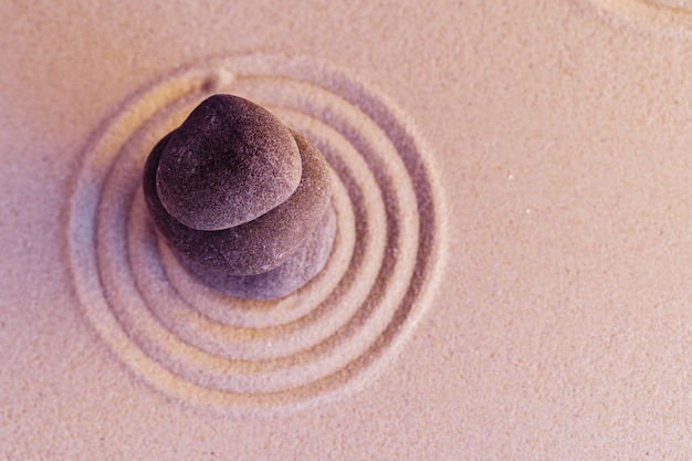 Premium Photo | Zen garden stones on sand with ornament copy space