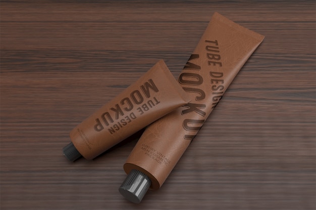 Download 3d packaging design mockup of two lying vintage leather tubes | Premium PSD File