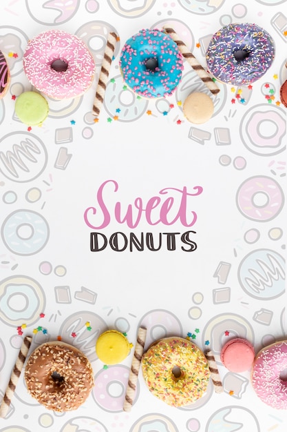 Download Arrangement of colorful donuts with mock-up | Free PSD File