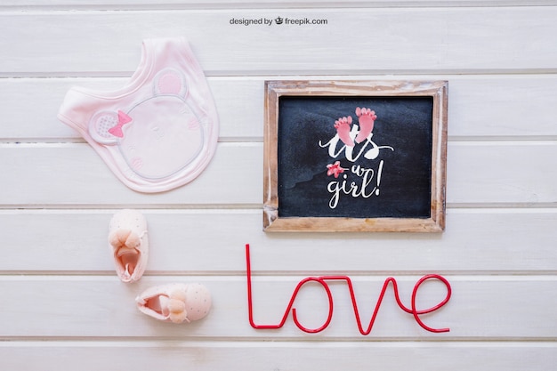 Download Free PSD | Baby girl mockup with slate