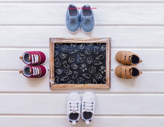 Download Free PSD | Baby mockup with four pairs of shoes