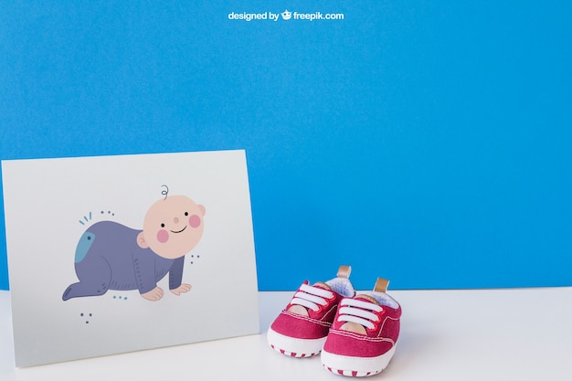 Download Free PSD | Baby mockup with paper and a pair of shoes
