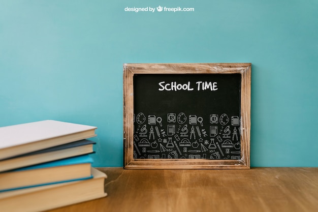 Back to school composition with slate and books PSD Template